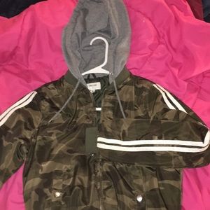 camo windbreaker with gray hood.